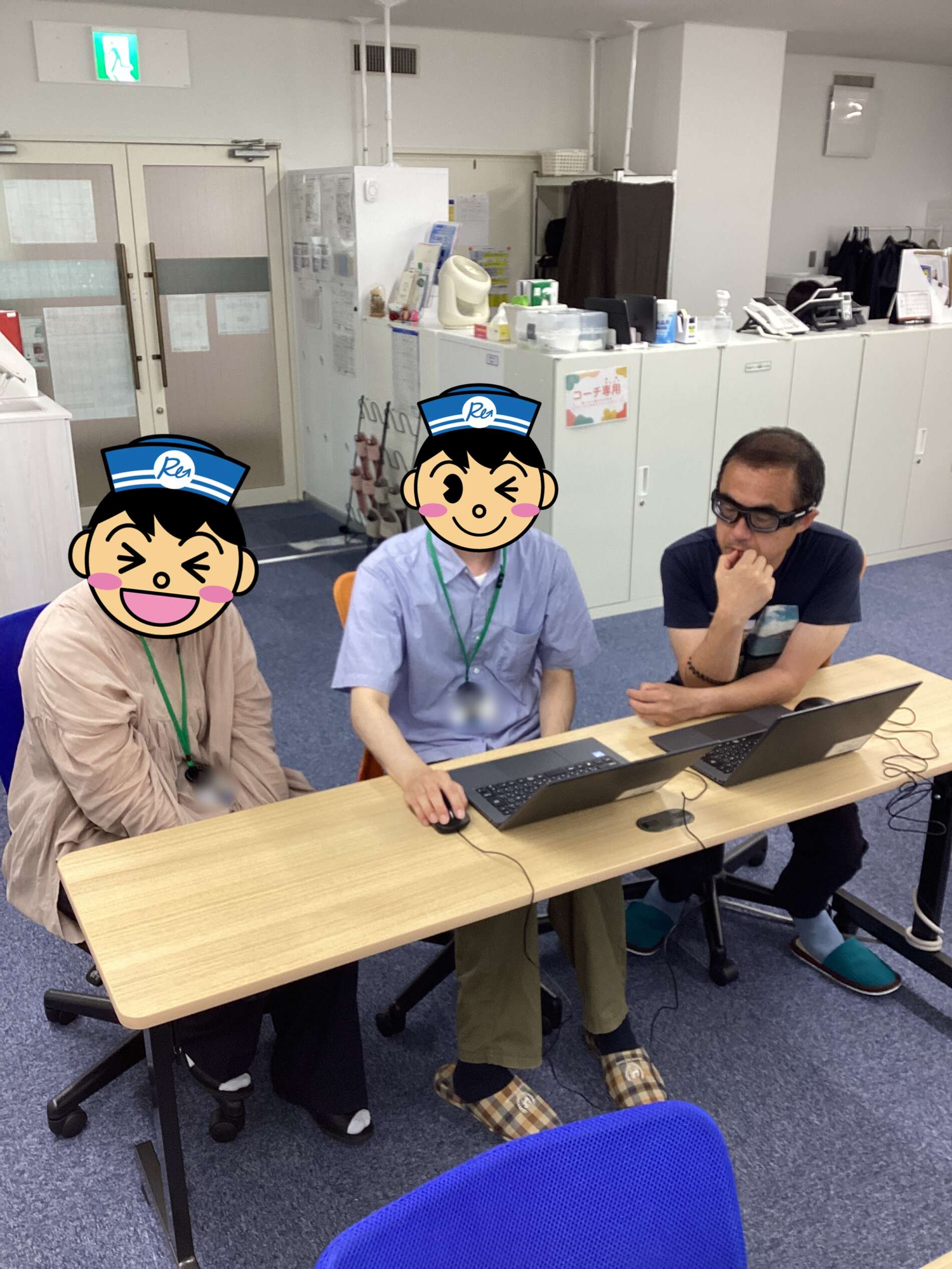 Three people seated at a table with laptops in an office, their faces covered by cartoon nurse avatars.