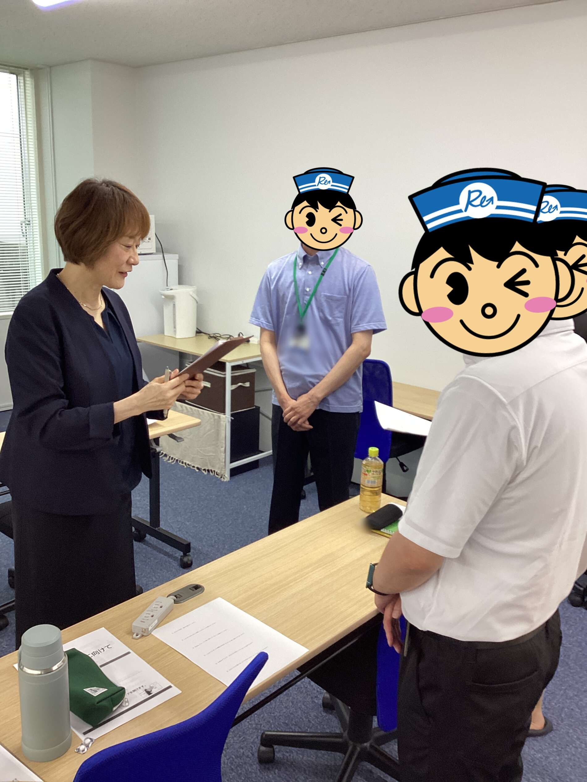 Woman in dark blazer showing documents to two people with cartoon nurse hats in an office setting.