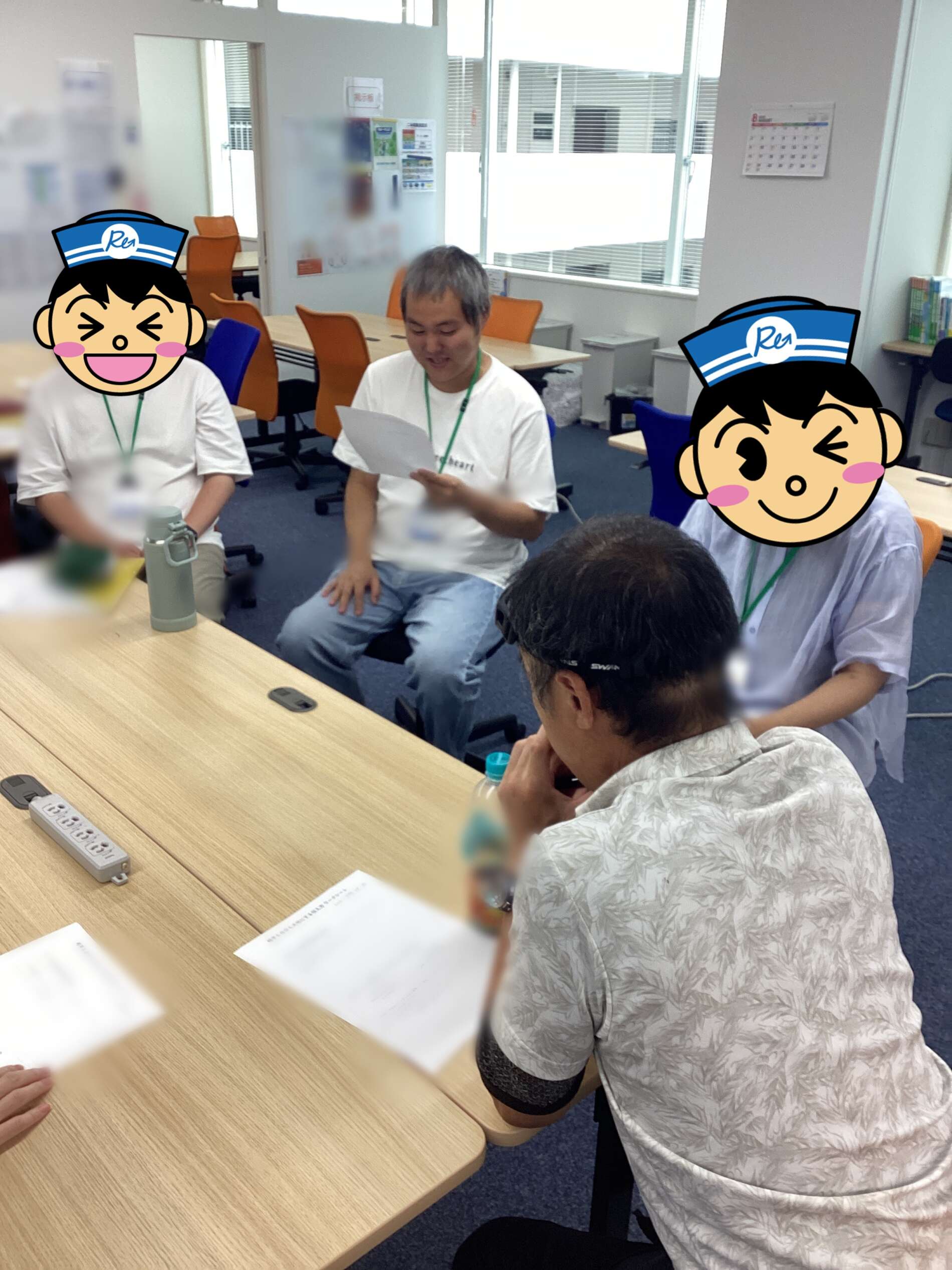 People seated around a conference table in an office, one man reads a sheet of paper while others listen, with cartoon avatars covering some faces for privacy.
